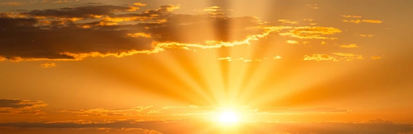 Amanecer con rayos de sol atravesando las nubes, imagen que evoca la luz y la conciencia